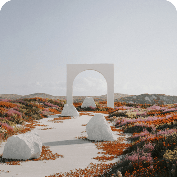 Path with large white stones leading to a minimalist white arch surrounded by colorful wildflowers under a clear sky.
